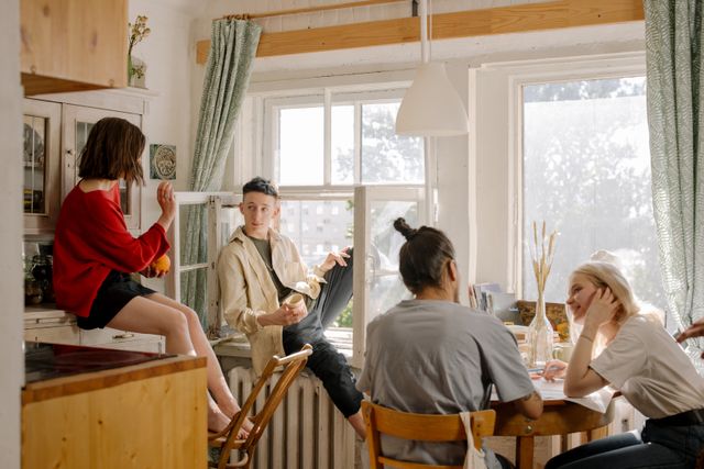 group of young adults in a shared living space